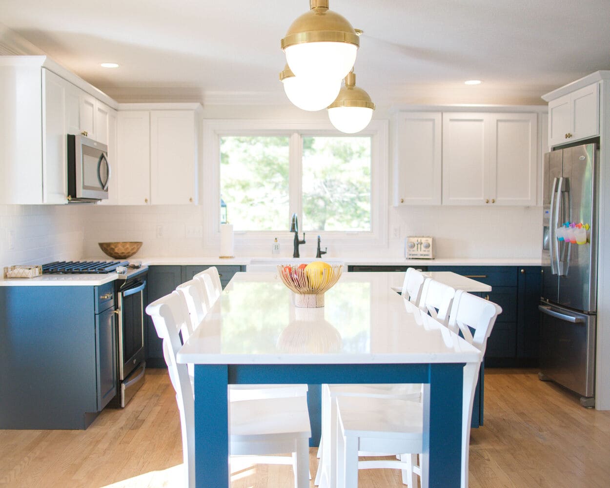 Two-Tone Kitchen Remodel With Blue Lower Level Cabinets and White Upper Level Cabinets