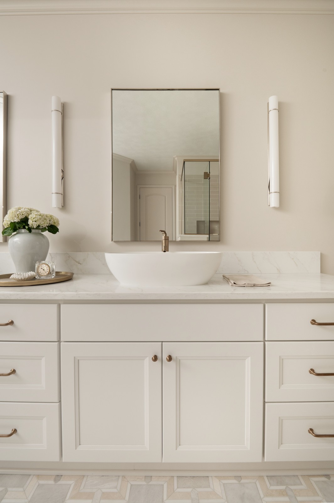 Single vanity with vessel sink and brass fixtures in Michiana primary bathroom remodel