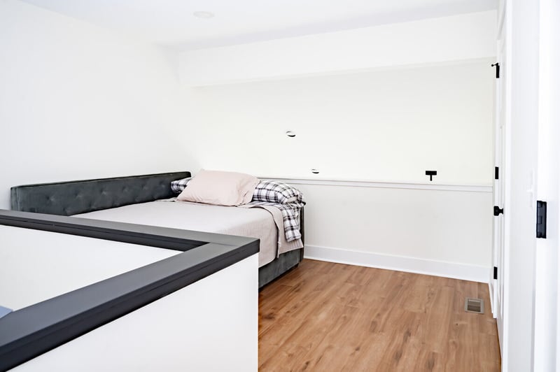 Bedroom remodel with hardwood flooring by Peacock & Company