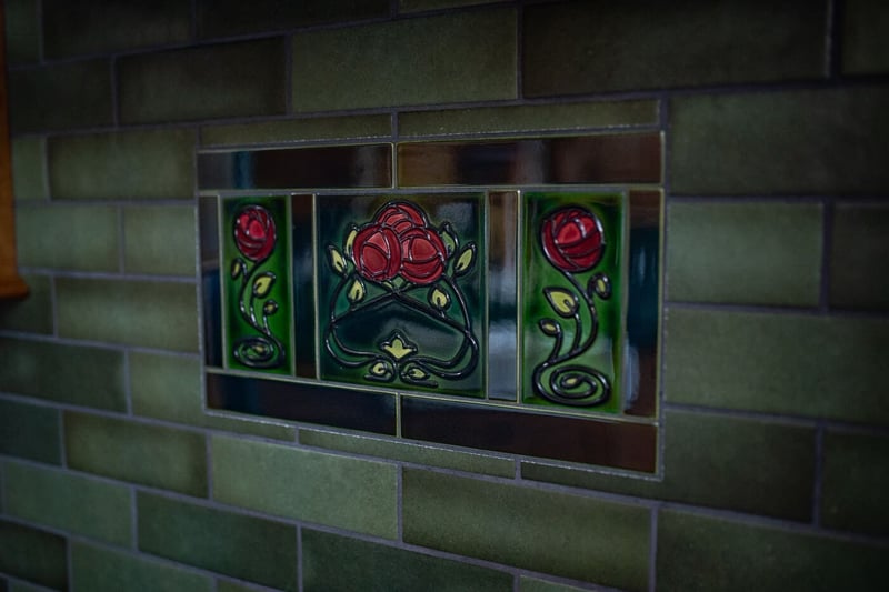 Mosaic tile on backsplash with painted roses in South Bend kitchen remodel