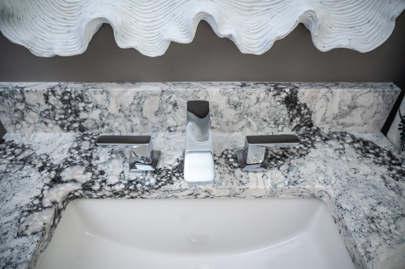 Black and white stone countertop in Granger, Indiana powder room remodel by Peacock and Company