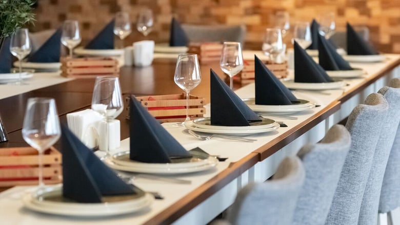 Event Space at Country Club With Dining Tables Set Up for Guests