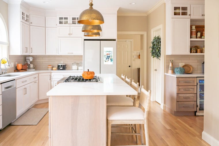 Bristol, Indiana kitchen remodel with island and seating below pendant lighting by Peacock & Company