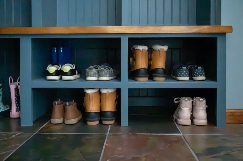 Mudroom remodel by Peacock & Company in South Bend with built-in shoe storage