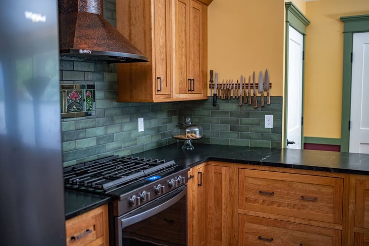 Craftsman-style kitchen remodel with green subway tile backsplash in Granger, IN