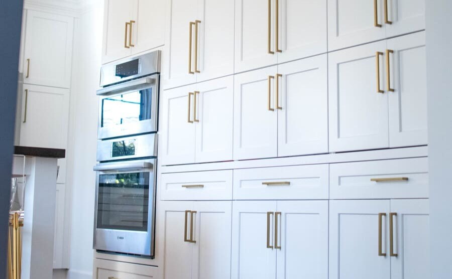 Custom floor-to-ceiling white shaker cabinets with double oven built-in South Bend kitchen remodel