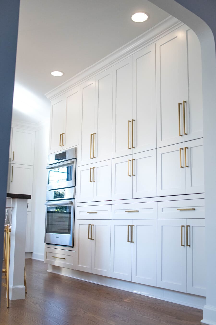 Custom floor-to-ceiling white shaker cabinets with double oven built-in South Bend kitchen remodel