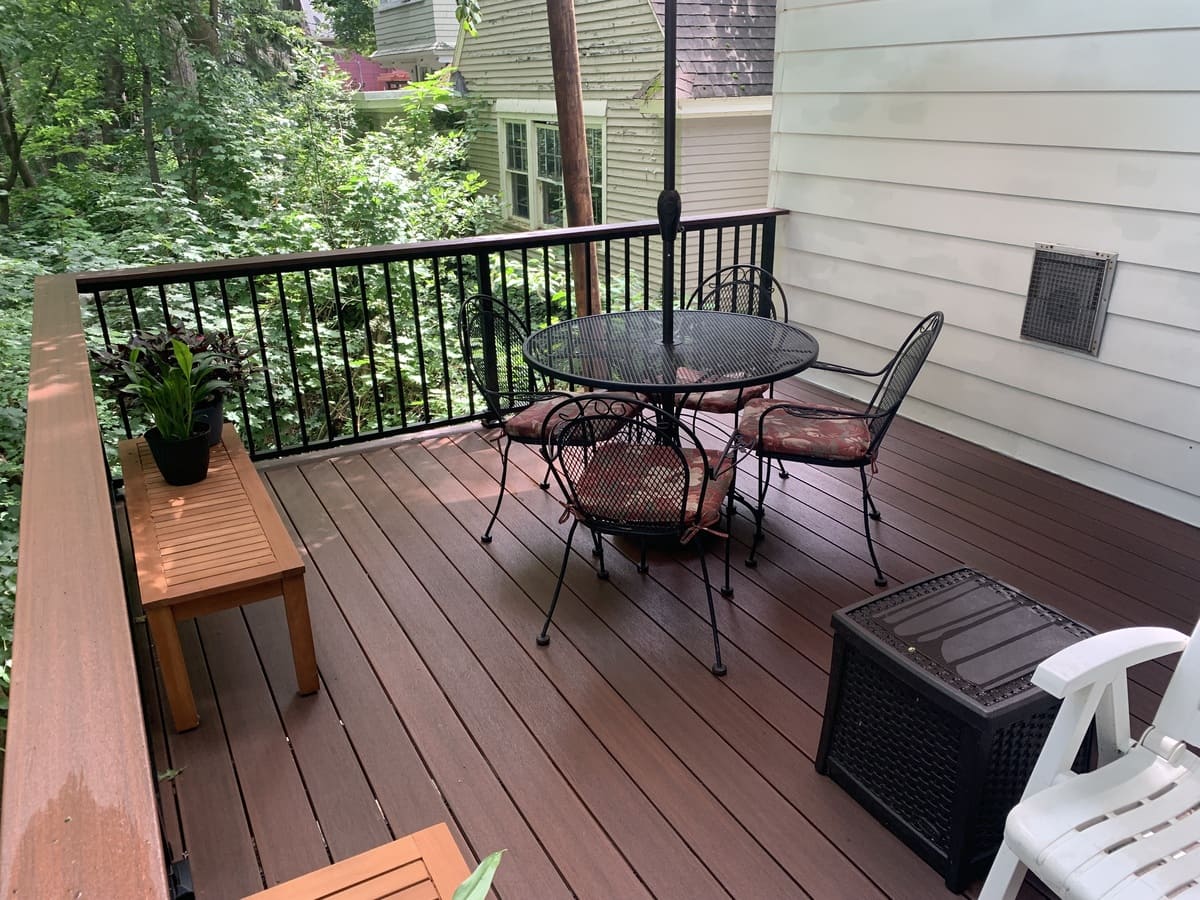 Custom raised deck with Westbury railing and furniture by Peacock & Company