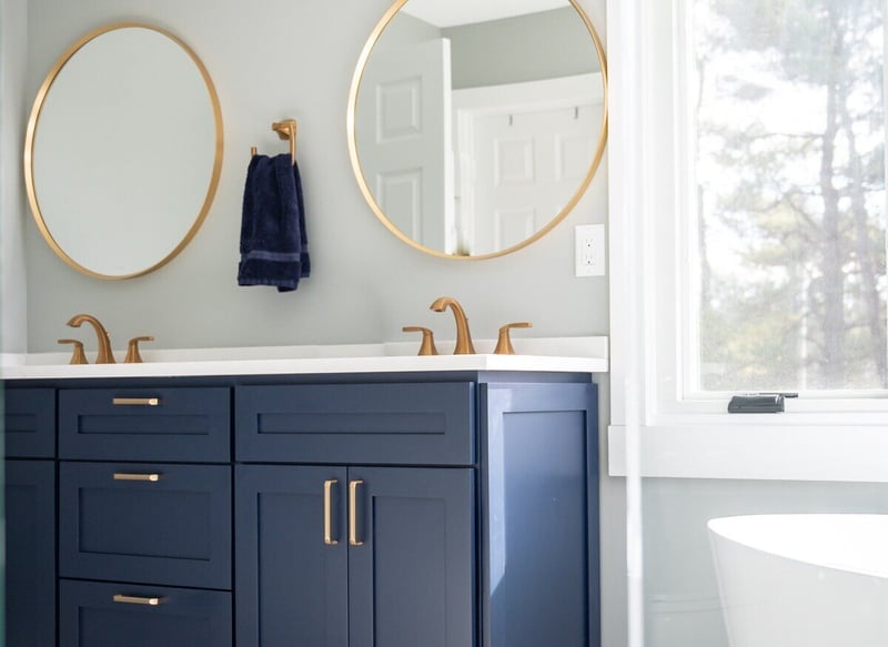 Double blue vanity in bathroom remodel by Peacock & Company