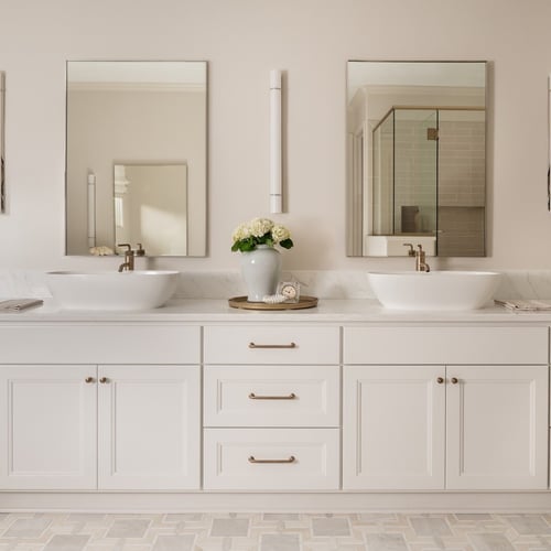 Double vanity with two vessel sinks and brass wall sconces in Michiana primary bathroom, designed by Peacock and Co