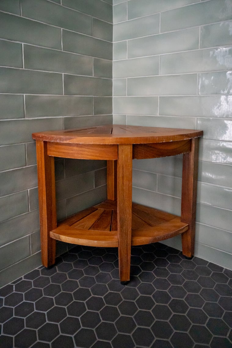 Close up of hexagonal shower tile and glossy subway tile