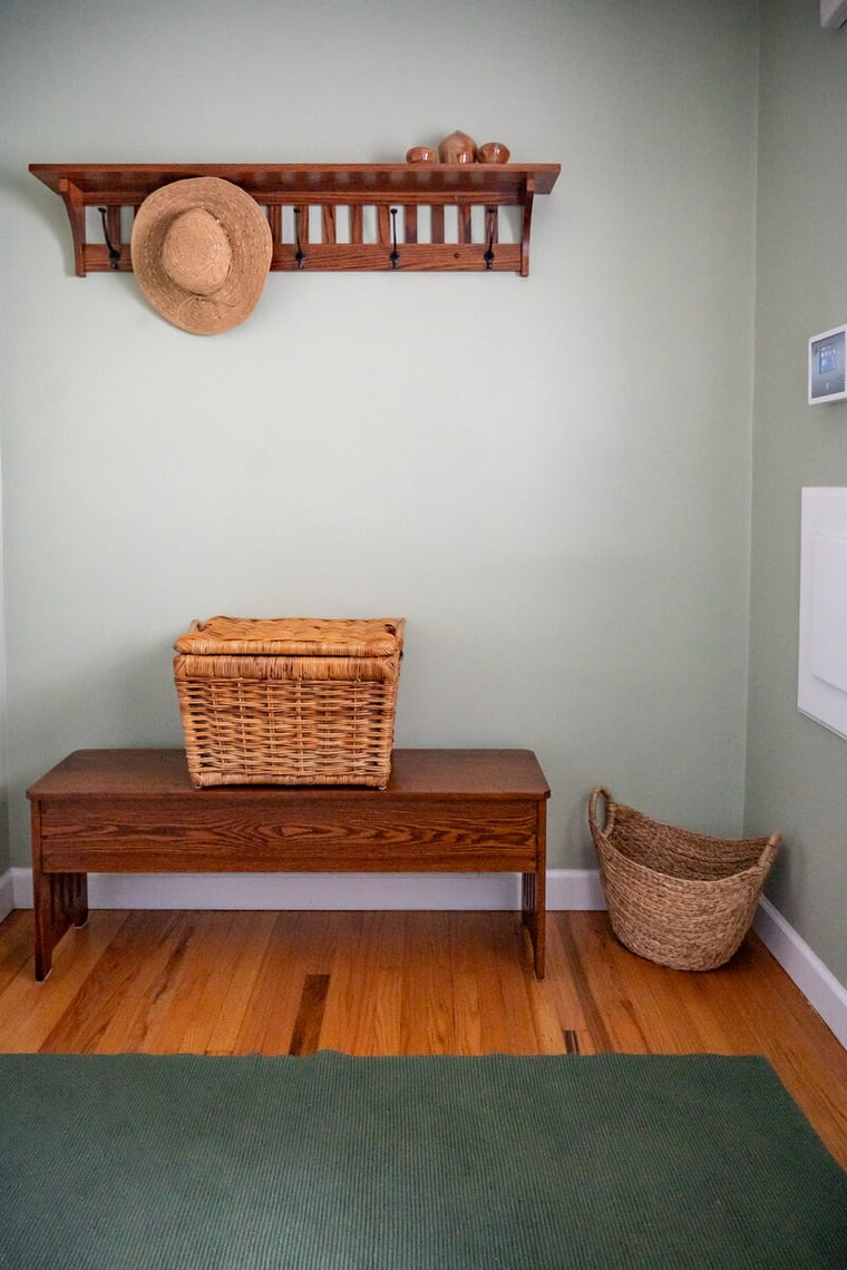 Mudroom remodel with pench and floating shelf by Peacock & Co in South Bend