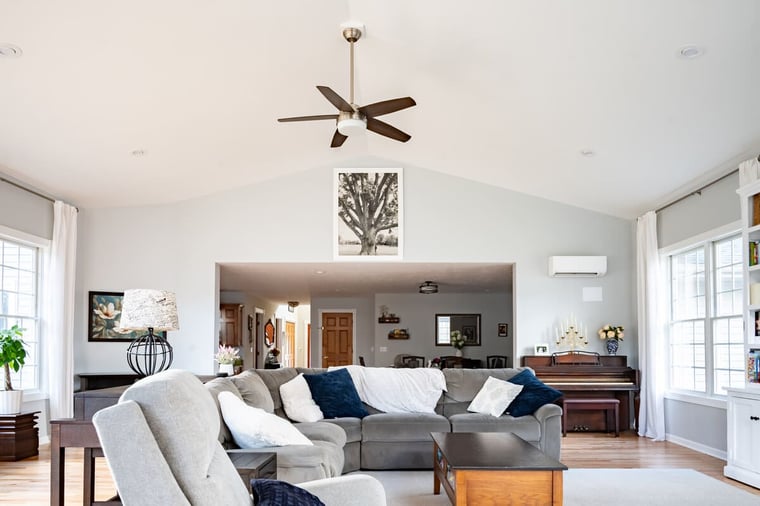 Five blade ceiling fan in sunroom addition with vaulted ceiling design by Peacock & Company