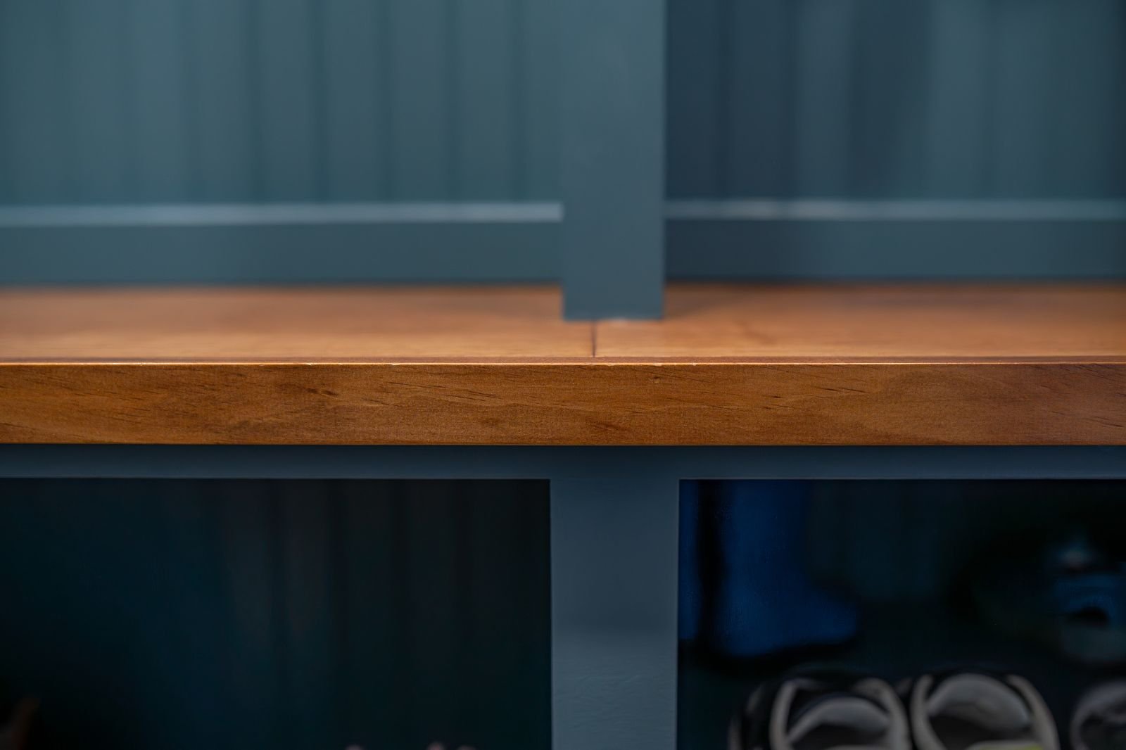 Close-up of wooden bench detail in a built-in storage unit located in Granger, IN