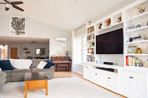 Harbor Country sunroom addition built in book shelf with floating tv