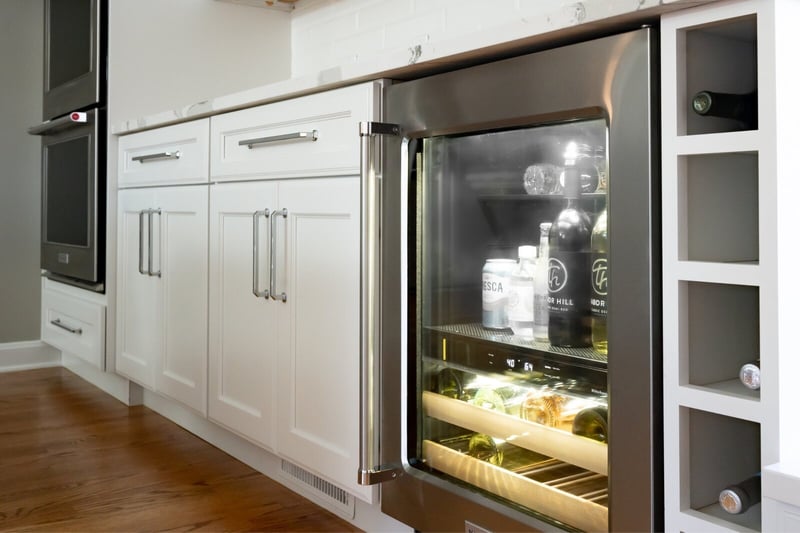 Stainless steel beverage fridge with built-in wine bottle shelving