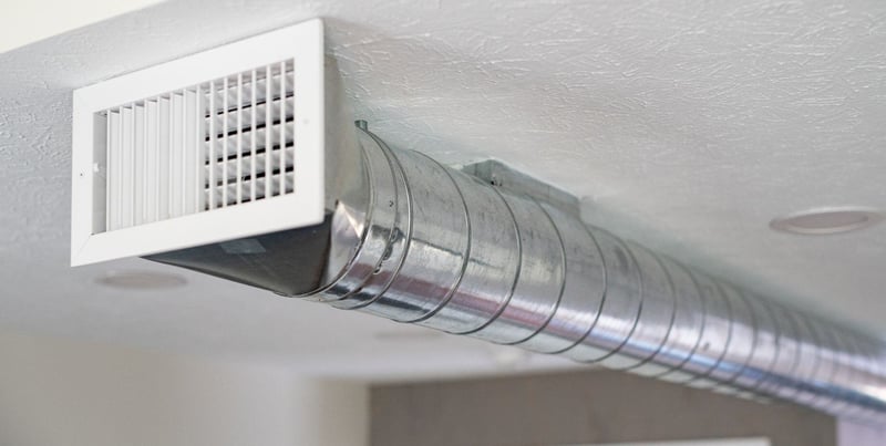 Spiral exposed ductwork in South Bend condo remodel by Peacock & Company 