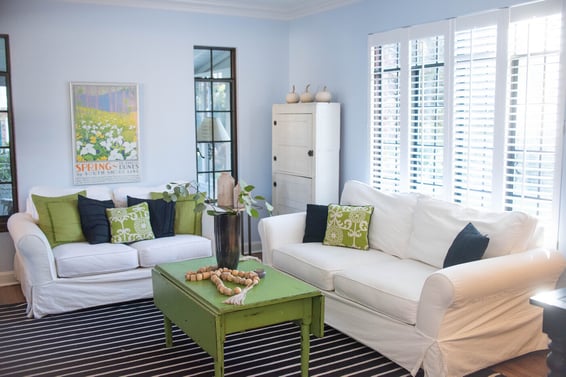 Living room in South Bend home remodel with natural light from windows by Peacock and Company