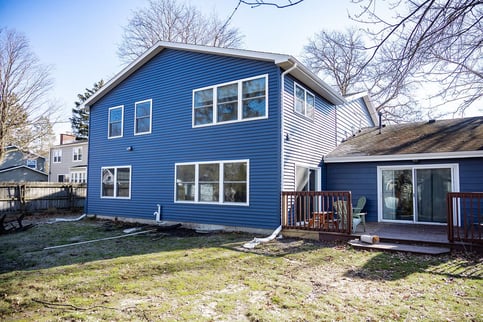 Low pitch roof on home addition exterior in South Bend by Peacock & Company