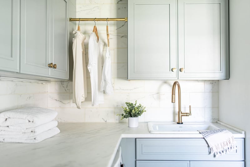 Mudroom renovation near South Bend, Indiana with farmhouse style cabinetry and brass fixtures