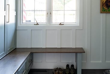 Mudroom renovation with built-in bench and storage in South Bend, IN by Peacock & Company