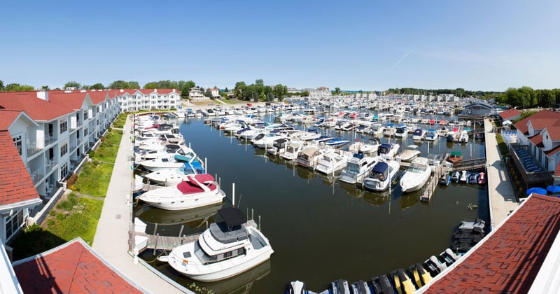 New Buffalo, Michigan harbor on sunny day with boats in docks