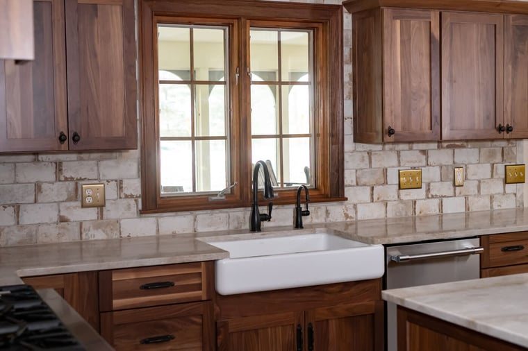 Oak shaker cabinets and Taj Mahal countertop in Granger, Indiana kitchen remodel