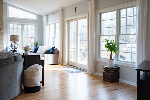Osceola, IN sunroom addition with sliding door to deck by Peacock & Company