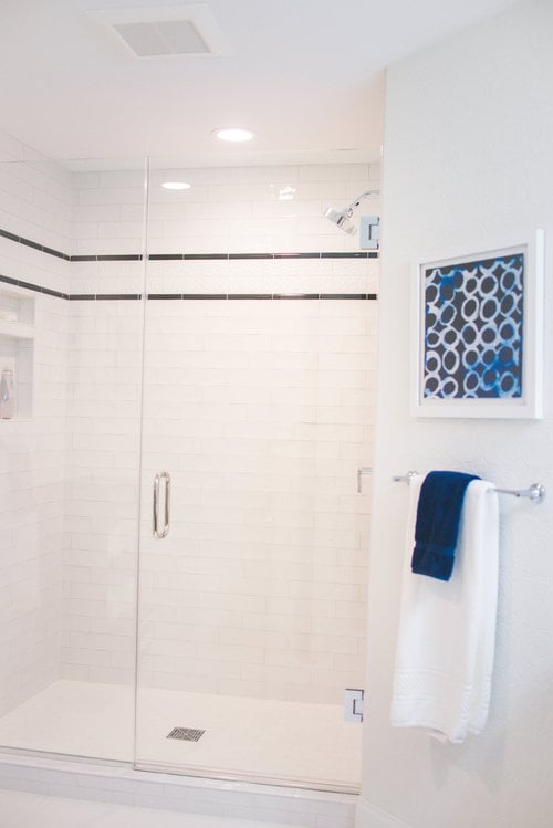 White bathroom remodel with walk-in shower