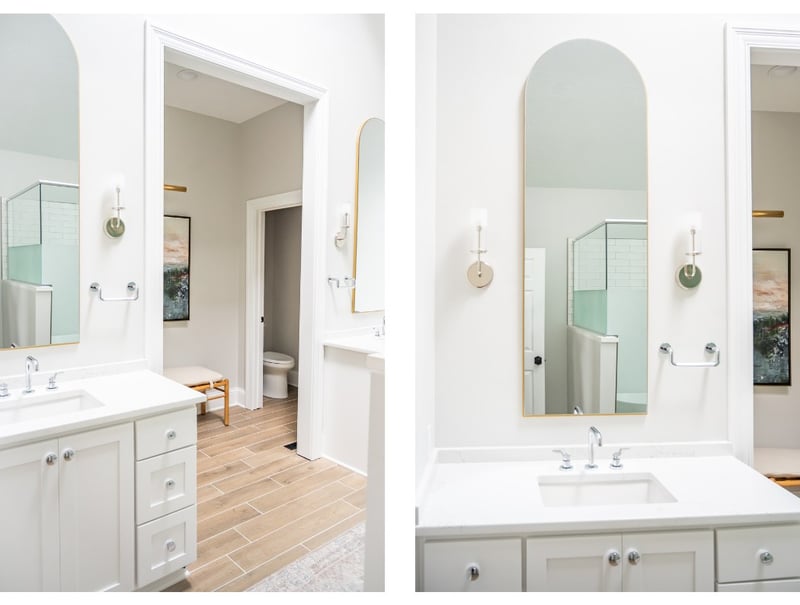 Primary bathroom renovation with separate double vanities and built-in towel racks by Peacock and Company