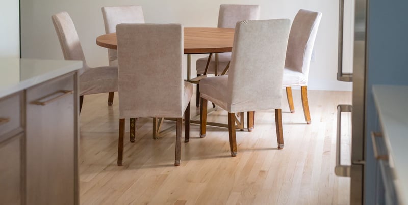 Hardwood flooring in Granger, IN kitchen remodel by Peacock & Company with dining table