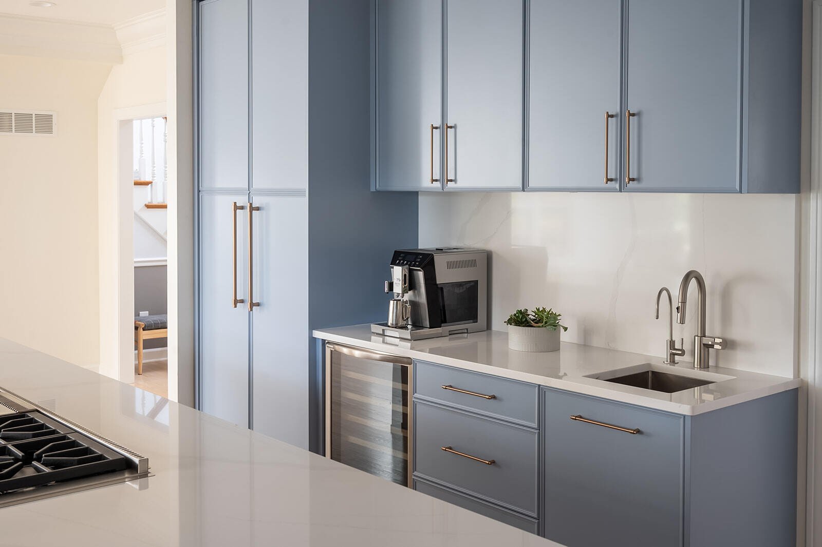 Beverage station with fridge in South Bend, IN kitchen remodel by Peacock & Company