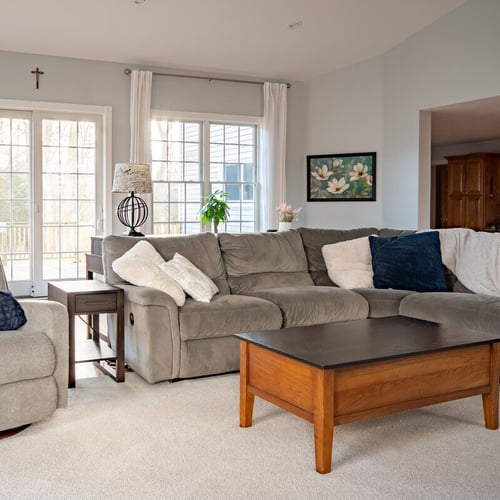 Recliner and couch in sunroom addition by Peacock &amp; Company