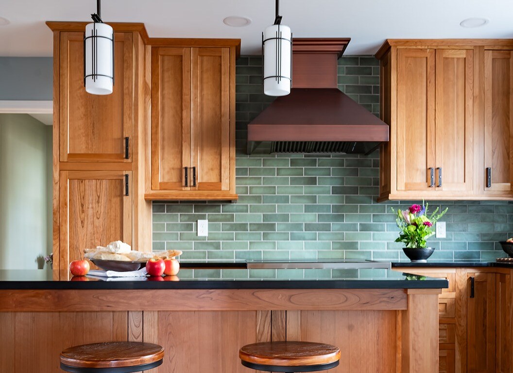 South Bend, IN craftsman style kitchen remodel with green tile backsplash by Peacock & Company