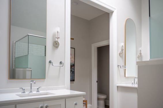 Two vanities between wide doorway in South Bend, IN bathroom remodel by Peacock and Company