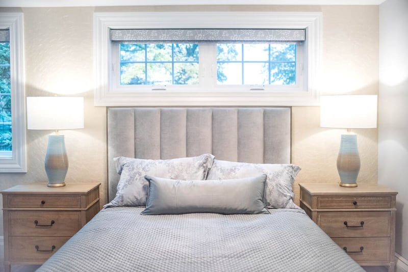 View of bedroom in South Bend home remodel with window and shades above frame