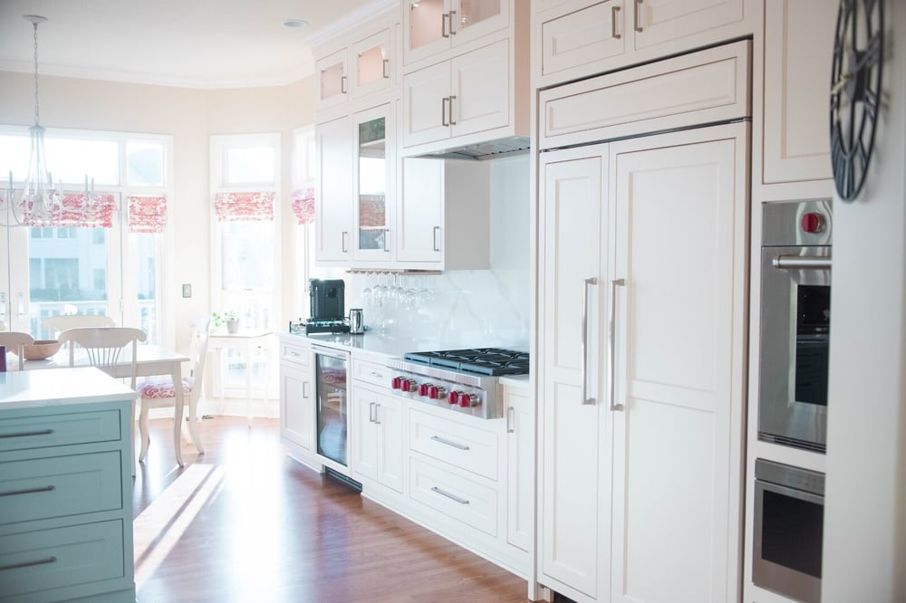 built in fridge white cabinets and professional stove kitchen remodel