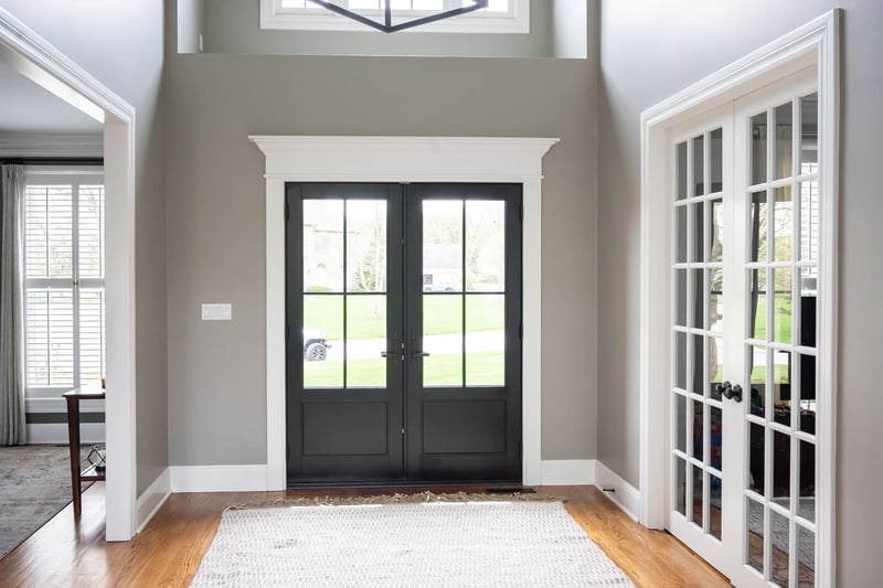 Contemporary entryway with French doors to office