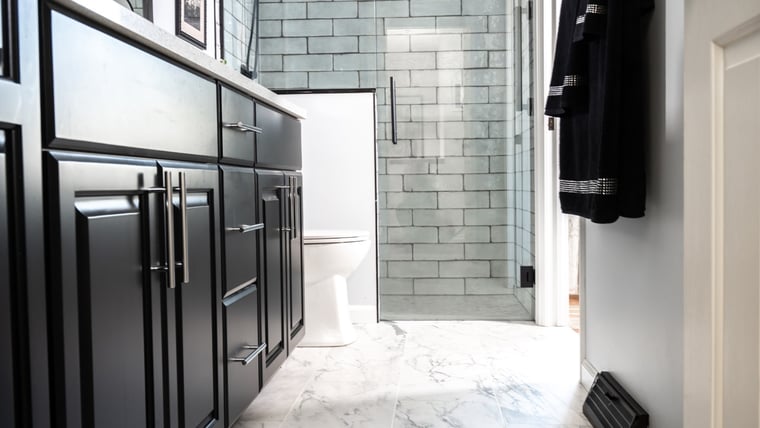 Dark cabinets with luxury marble flooring 