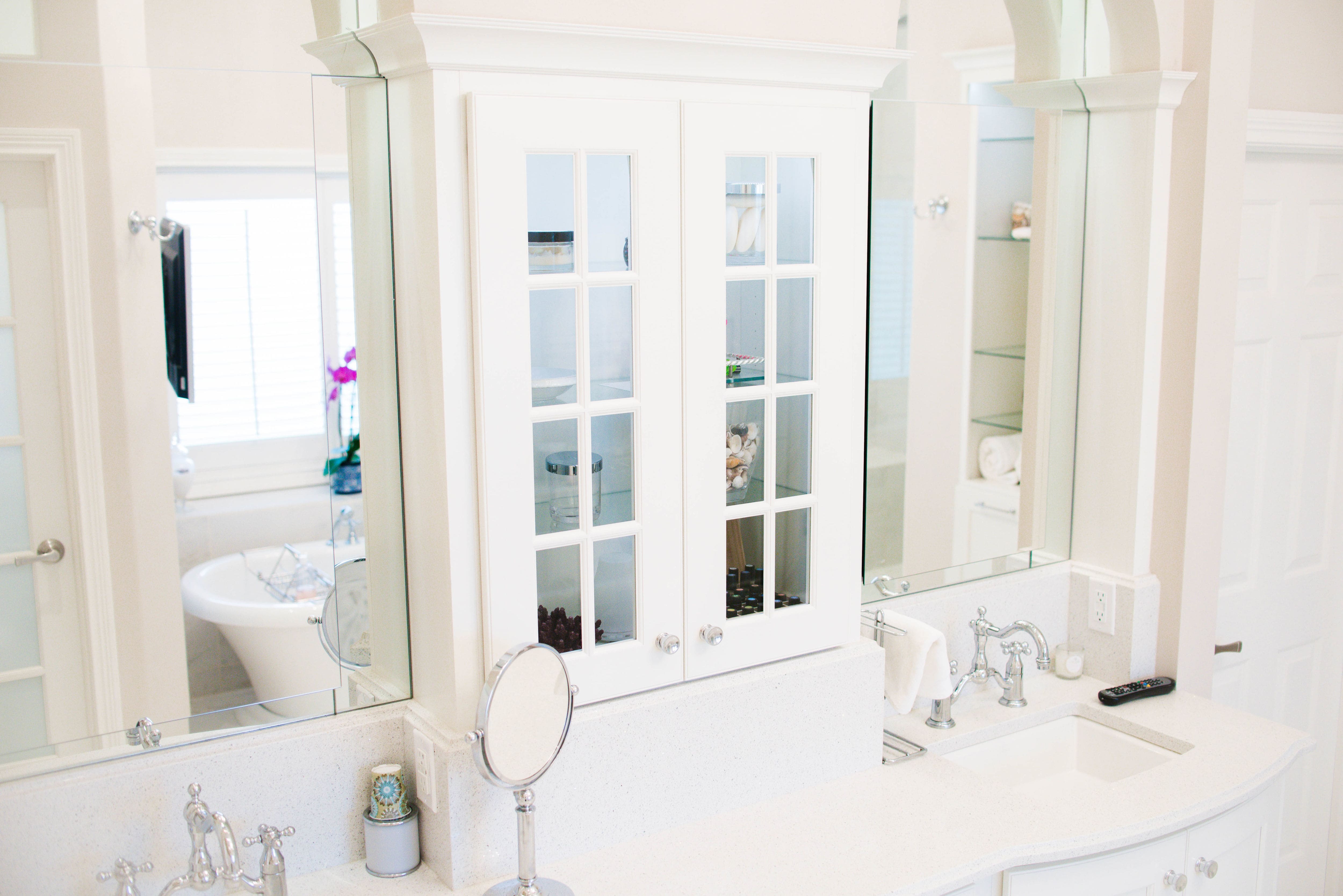 glass case and dual sinks in bathroom remodel south bend