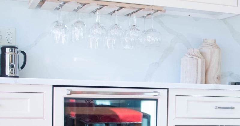 Home beverage area with wine rack and beverage fridge
