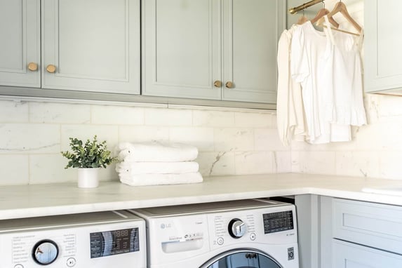Luxury mudroom renovation with custom cabinetry and washer dryer