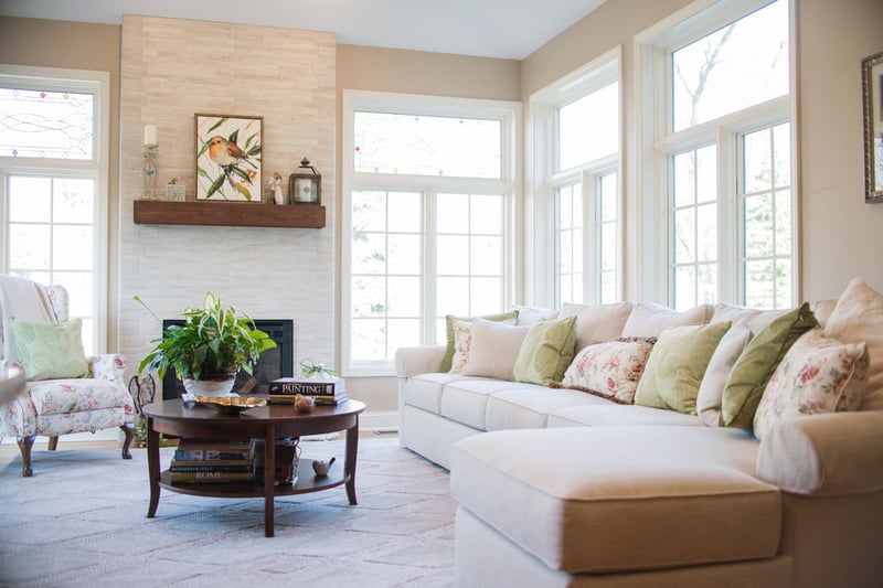 Modern indoor sunroom addition with custom fireplace